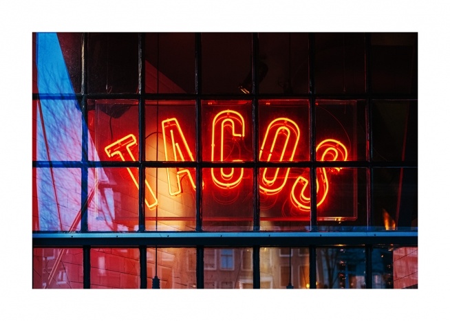  - Foto van een neonbord taco´s in rood achter zwarte tralies in een raam
