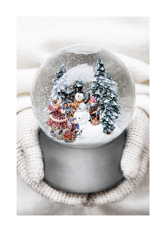  – Foto van een kleine sneeuwbol met een sneeuwpop, bomen en kinderen erin